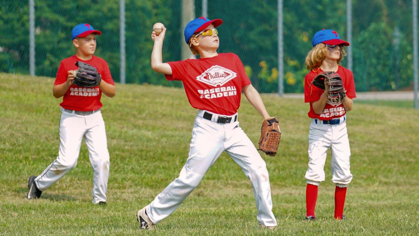 Three campers in the outfield